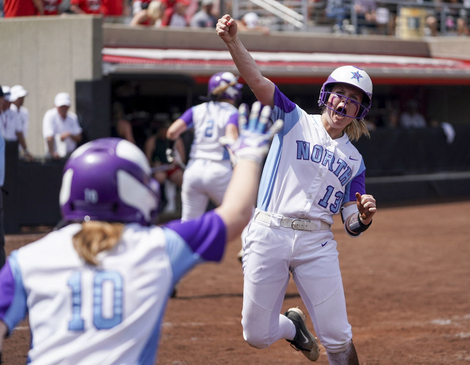 WIAA state softball photo: Waukesha North celebrates the tying run against Sun Prairie